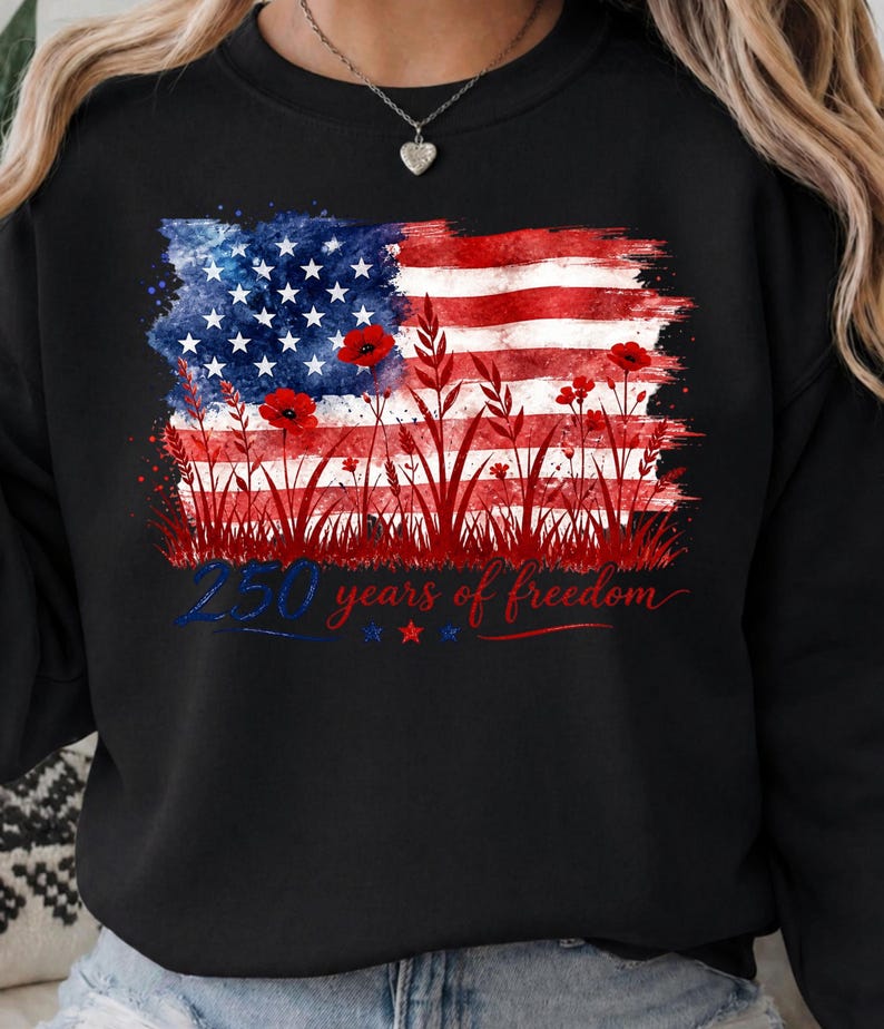 Patriotic floral USA flag PNG graphic displayed on a colorful pastel black sweatshirt mockup.