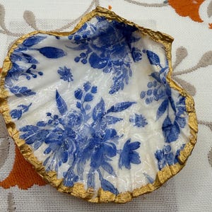 May include: A rustic wooden sign with the text "Welcome to our home" in white lettering. The sign features a distressed finish and a simple, inviting design, perfect for a front porch or entryway.