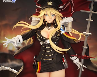 May include: A blonde anime-style figurine wearing a black military-inspired uniform with gold trim, a peaked cap, and a long red-lined cape. The character holds a tall metallic staff and wears white gloves, with text reading SHINOBU SCULPTS.
