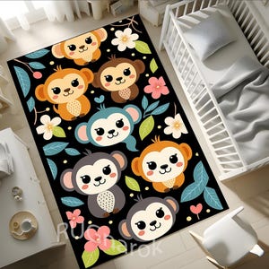 May include: A rectangular black rug featuring cartoon monkeys in various colors, including orange, brown, and gray. The rug is decorated with flowers and leaves in pink, white, and green. The rug is placed on a light-colored wooden floor.