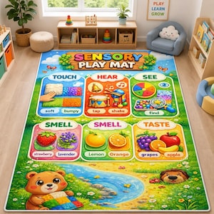 May include: A rectangular sensory play mat featuring colorful illustrations of the five senses. The mat displays sections for touch, hear, see, smell, and taste with labels and icons. A cartoon bear sits near a blue stream at the bottom.