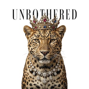 May include: A regal leopard illustration wearing a jeweled crown and necklace. The text "UNBOTHERED" is displayed above the leopard's head in a bold, black font. The leopard has a spotted coat and is set against a white background.