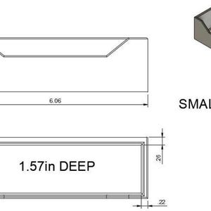 May include: A small rectangular container with dimensions labeled in inches. The container is 6.06 inches long, 1.77 inches high, and 1.57 inches deep. The text "SMALL" is also present.