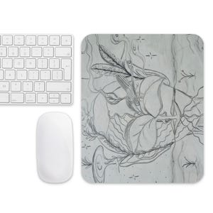 May include: A white wireless keyboard and mouse set next to a rectangular mousepad. The mousepad features a pencil sketch of leaves, vines, and a dragonfly. The keyboard has a standard layout.