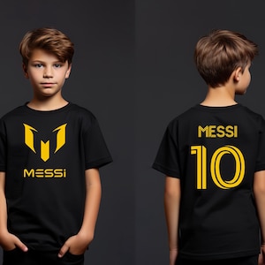 a young boy wearing a messi shirt