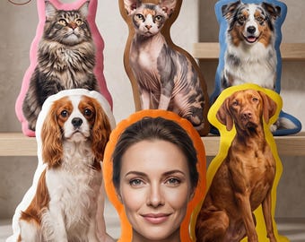 May include: A collection of six custom-shaped pillows featuring printed portraits of various animals and a person. The set includes a fluffy cat, a hairless cat, a blue-bordered dog, a spaniel, a yellow-bordered dog, and a person's face.