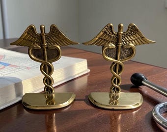Vintage Pair Of Solid Brass Caduceus Symbol Bookends.