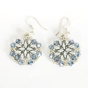 May include: Silver snowflake earrings with blue crystal beads.