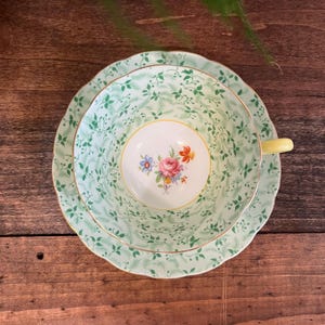 May include: A set of three ceramic mugs with a speckled, matte finish. The mugs are in shades of cream, light gray, and dark gray. Each mug has a simple, minimalist design, perfect for coffee or tea.