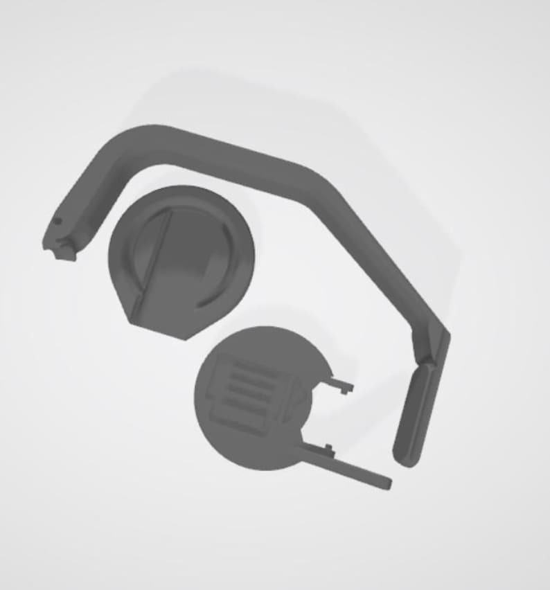 May include: A collection of gray 3D-printed parts, including a curved handle, a circular base with a raised center, and a second circular piece with a rectangular design. The parts are arranged against a white background.