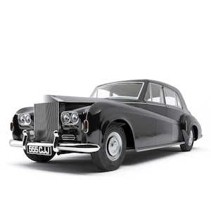 May include: A black vintage luxury sedan featuring a prominent vertical grille, dual round headlights, and a chrome front bumper. The vehicle displays a license plate reading 555 CJJ on the front, with classic curved fenders and silver wheels.