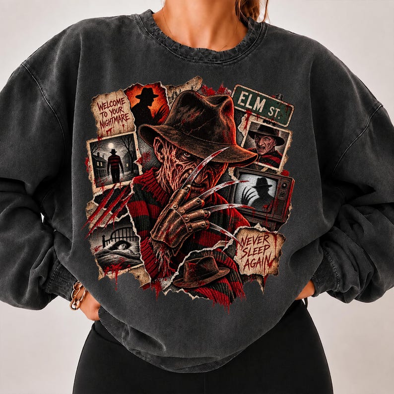 May include: A charcoal gray crewneck sweatshirt featuring a graphic print of a horror movie character with a clawed hand, a fedora, and a red and black striped sweater. The design includes text reading Welcome to your nightmare, Elm St., and Never sleep again.