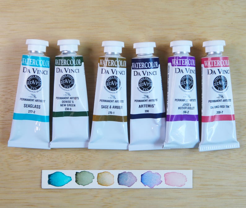 I handpicked these colors for their AMAZING performance!!! The Da Vinci Tropical Palette includes 6 half pans of the following colors: Sage & Amber, Joyce's Mother Violet, Denise's New Green, Artemis, Seaglass, Da Vinci Red Tint. Each is a professional-grade fine arts watercolor paint. I have these in stock, ready to ship in Half Pans, Quarter Pans, or dot cards.