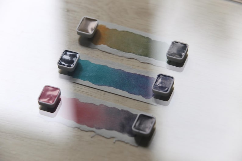 I handpicked these colors for their AMAZING performance!!! The Da Vinci Tropical Palette includes 6 half pans of the following colors: Sage & Amber, Joyce's Mother Violet, Denise's New Green, Artemis, Seaglass, Da Vinci Red Tint. Each is a professional-grade fine arts watercolor paint. I have these in stock, ready to ship in Half Pans, Quarter Pans, or dot cards.