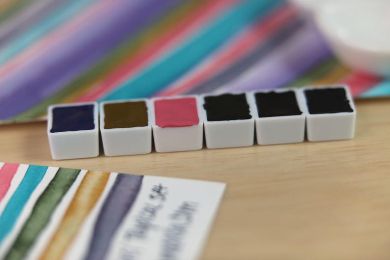 I handpicked these colors for their AMAZING performance!!! The Da Vinci Tropical Palette includes 6 half pans of the following colors: Sage & Amber, Joyce's Mother Violet, Denise's New Green, Artemis, Seaglass, Da Vinci Red Tint. Each is a professional-grade fine arts watercolor paint. I have these in stock, ready to ship in Half Pans, Quarter Pans, or dot cards.