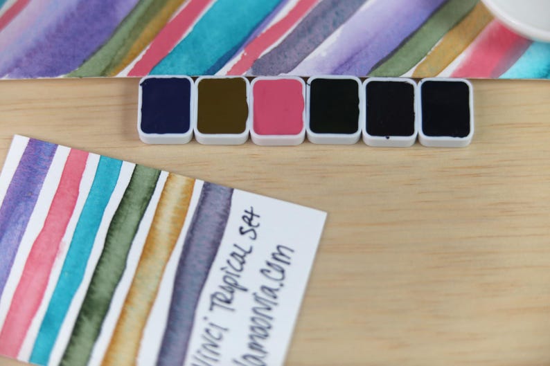 I handpicked these colors for their AMAZING performance!!! The Da Vinci Tropical Palette includes 6 half pans of the following colors: Sage & Amber, Joyce's Mother Violet, Denise's New Green, Artemis, Seaglass, Da Vinci Red Tint. Each is a professional-grade fine arts watercolor paint. I have these in stock, ready to ship in Half Pans, Quarter Pans, or dot cards.