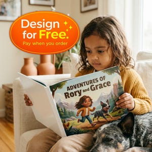 Może przedstawiać: Książka dla dzieci w twardej oprawie zatytułowana Adventures of Rory and Grace z ilustrowaną okładką przedstawiającą dziecko i psa biegnących przez g&oacute;rski krajobraz. Książka ma biały grzbiet i jest otwarta, ukazując kolorową grafikę.