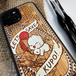 May include: Wooden phone case with a laser-etched design featuring a white cartoon cat, a red feather, and the text "LET'S SAVE KUPO!". The case has a black border and a natural wood grain finish. The design is detailed and artistic.