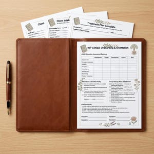 May include: A brown leather-effect folder containing an IOP Clinical Onboarding & Orientation form, with additional Client Intake and Treatment Plan templates tucked behind. A black and gold fountain pen rests to the left of the open folder.