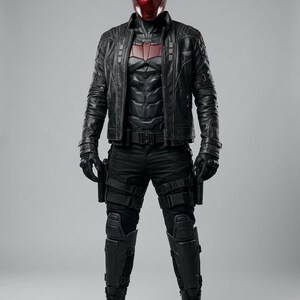 Red Hood inspired cosplay, premium leather jacket, Jason Todd, Gotham City fashion, comic book costume, superhero apparel, anti-hero aesthetic, high detail armor, convention outfit, cosplay photography, luxury cosplay gear, red bat logo, tactical style jacket, mens hero suit, realistic costume, high quality materials, detailed stitching, embossed logo, layered body armor, utility straps, premium craftsmanship, cosplay collector.
