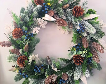 Traditional Christmas wreath. Artificial foliage pine, spruce, maple, pine cones, blue berries. Door Wall Mantle decoration, Xmas Gift