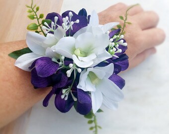 Wrist corsage. Artificial flowers purple and white orchids. High school formal, prom. Wedding, mother of the bride, flower wrist corsage.