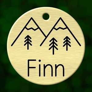 Custom mountain dog tag. Round pet ID name tag personalized with deep engraving. Handmade pet product. Unique pet gift.