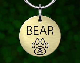 Custom paw print dog tag. Personalized pet ID with deep engraving. Made in Oregon.