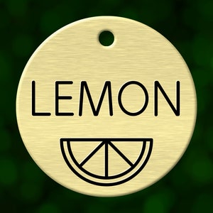 Custom lemon dog tag. Round pet ID name tag personalized with deep engraving. Handmade pet product. Unique pet gift.