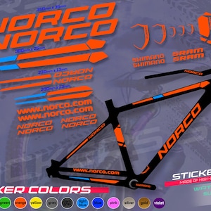 May include: A black and orange Norco bicycle sticker set. The set includes various stickers with the Norco logo, website address, and measurements in millimeters. The stickers are waterproof and sun-resistant.