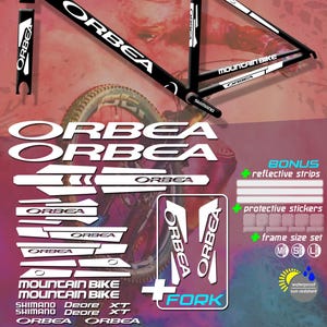 May include: A frame stickers set for a mountain bike, featuring the brand "ORBEA" in white on a black frame. Includes bonus reflective strips and protective stickers. Available in various sizes and colors.