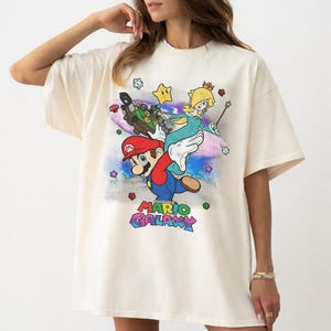 May include: A set of three ceramic mugs with a speckled, matte finish. The mugs are in shades of cream, light gray, and dark gray. Each mug has a simple, modern design and a rounded handle. Perfect for coffee or tea.