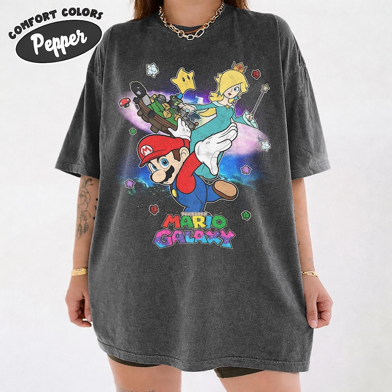 May include: A white ceramic mug with a black handle and the text "But First, Coffee" in a black, bold font. The mug is sitting on a white surface. The mug appears to be 12 ounces.