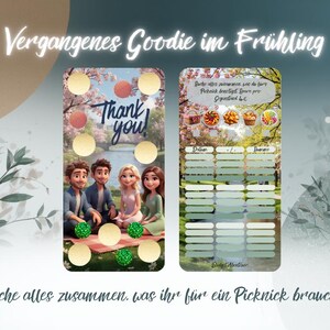 May include: Double-sided card with cartoon illustrations and the text "Thank You!" and "Vergangenes Goodie im Frühling". The card has a picnic theme with food images and a checklist. The bottom text reads "Suche alles zusammen, was ihr für ein Picknick braucht!"
