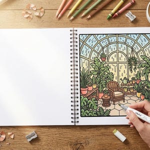 May include: A coloring book open to a detailed illustration of a greenhouse scene with plants, a wicker chair, and rain falling outside. Colored pencils, a sharpener, and a cup of coffee surround the book on a wooden surface.
