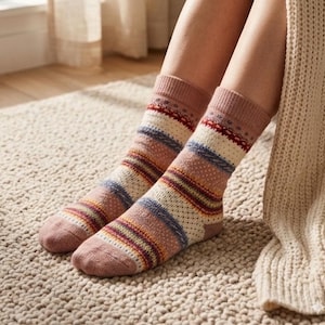 May include: A pair of patterned socks with a mix of colors, including pink, blue, and yellow stripes and dotted patterns. The socks are worn on a person's feet, with a beige rug in the background.