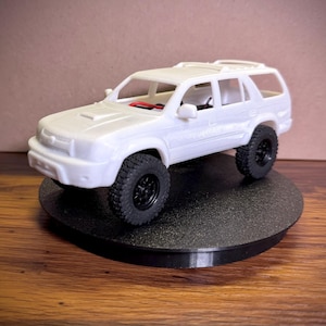 May include: A set of three ceramic mugs with a speckled, matte finish. The mugs are in shades of cream, light brown, and dark brown. Each mug has a simple, minimalist design, perfect for coffee or tea.