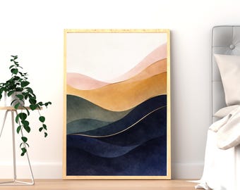 Puede incluir: Una impresión artística abstracta enmarcada con formas onduladas en capas en tonos de rosa, dorado, verde y azul marino. La obra de arte tiene líneas doradas y se muestra en un marco de madera clara.