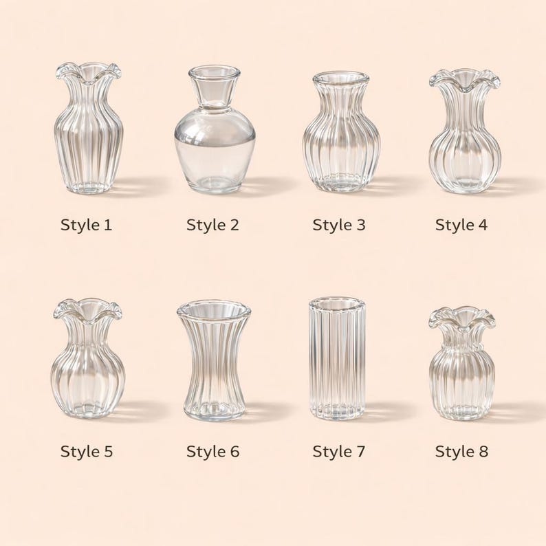 May include: A collection of eight clear glass vases in various styles. Each vase has a unique shape, including fluted, rounded, and cylindrical designs. The vases are labeled with the text "Style 1" through "Style 8".
