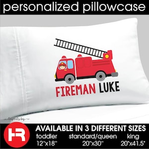 May include: White pillowcase with a red fire truck and ladder, a fireman in the driver's seat, and the text "FIREMAN LUKE". Available in three sizes: toddler (12"x18"), standard/queen (20"x30"), and king (20"x41.5").