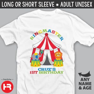 May include: White t-shirt with a colorful circus tent, elephant, lion, and the text "Ringmaster Cruz's 1st Birthday".