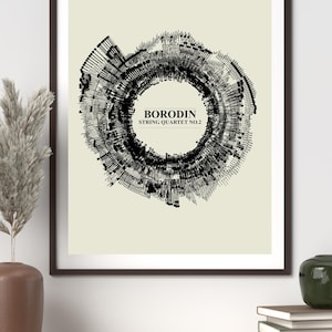 May include: Framed art print featuring a black and white abstract design. The artwork has a circular shape with the text "BORODIN STRING QUARTET NO.2" in the center. The print is displayed in a dark brown frame, suitable for home decor.