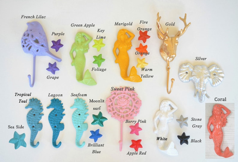 May include: Assortment of decorative hooks in various colors and shapes, including a bird, mermaid, deer, elephant, and seahorse. Each hook is paired with a small star-shaped accent in a coordinating color.