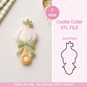 May include: A garlic-shaped rattle cookie cutter STL file. The design features a bulbous garlic head with green leaves, a sage green bow, and a tan handle. Text includes 5 sizes, Cookie Cutter STL FILE, Garlic Rattle, and Digital file only.