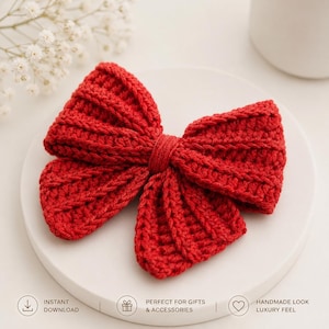 May include: A bright red crochet hair bow featuring a textured ribbed pattern and a central knotted detail. The bow is constructed from yarn with a visible stitch structure, creating a dimensional shape with two large loops and two smaller tails.