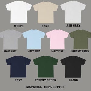 May include: A collection of ten different colored t-shirts, including white, sand, ash grey, sport grey, light blue, light pink, military green, navy, forest green, and black. The material is 100% cotton.
