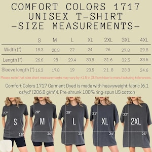 May include: A size chart for Comfort Colors 1717 unisex t-shirts, displaying width, length, and sleeve measurements in inches for sizes S to 4XL. It includes fabric details and five illustrations of individuals wearing sizes S through 2XL with labels.