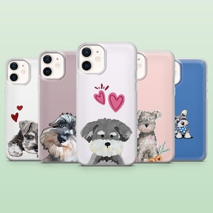 Könnte beinhalten: Fünf Handyhüllen mit Schnauzer-Hund-Designs. Die Hüllen zeigen verschiedene Schnauzer-Illustrationen, darunter Porträts und Herzmotive, in Weiß-, Rosa- und Blautönen. Die Hüllen sind für ein Mobiltelefon.
