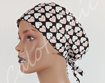 Women's Scrub Cap with Cute Hearts Pattern on a Black Background