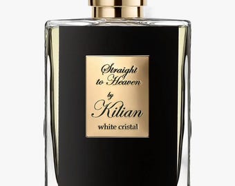 May include: A rectangular perfume bottle with a gold cap and a black label. The label features the text "Straight to Heaven by Kilian white cristal" in gold lettering. The bottle is clear, allowing the liquid inside to be visible.